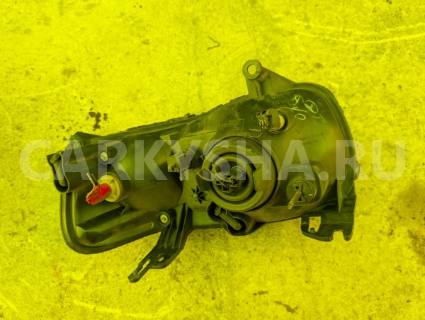 Фара Mazda Tribute 