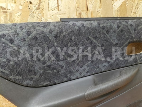 Обшивка двери (дверная карта) задняя левая Mazda Mazda Familia 